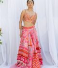 Pink patchwork lehengas with orange embroidered choli