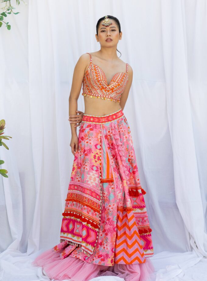 Pink patchwork lehengas with orange embroidered choli