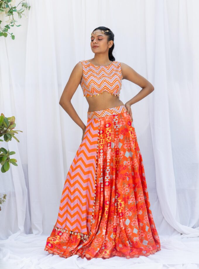 Orange kilim printed lehengas with chevron choli