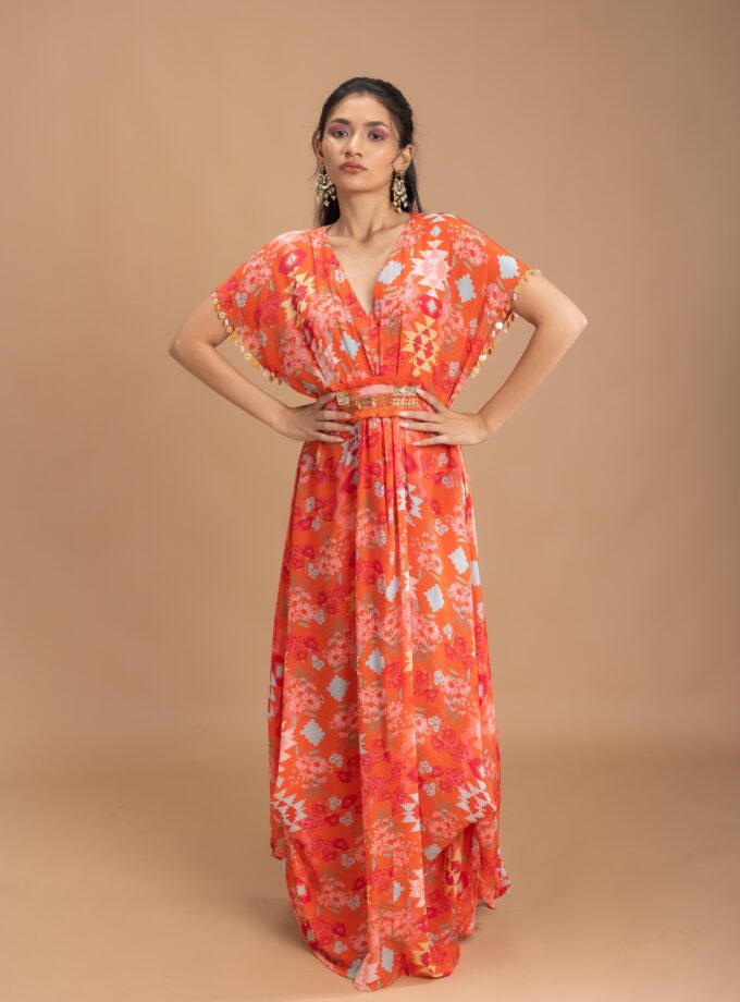 Coral printed kaftan with an embroidered belt and tassels