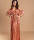 Orange printed kaftan with embroidery on the neck and embellished with tassels