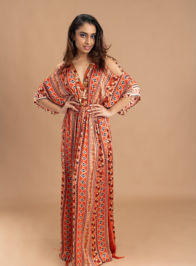 Orange printed kaftan with embroidery on the neck and embellished with tassels