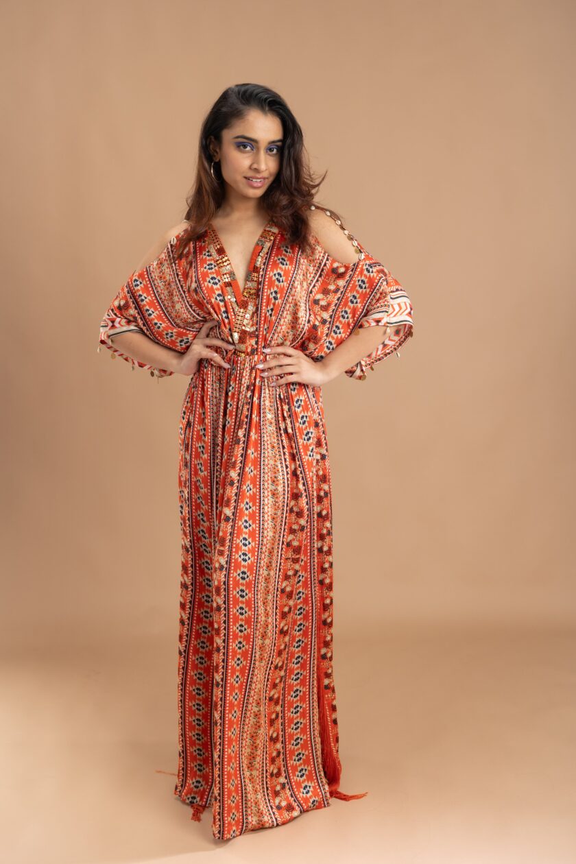 Orange printed kaftan with embroidery on the neck and embellished with tassels