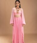 Pink Gathered georgette pants with korset choli embellished with intricate embroidery patch and a cape