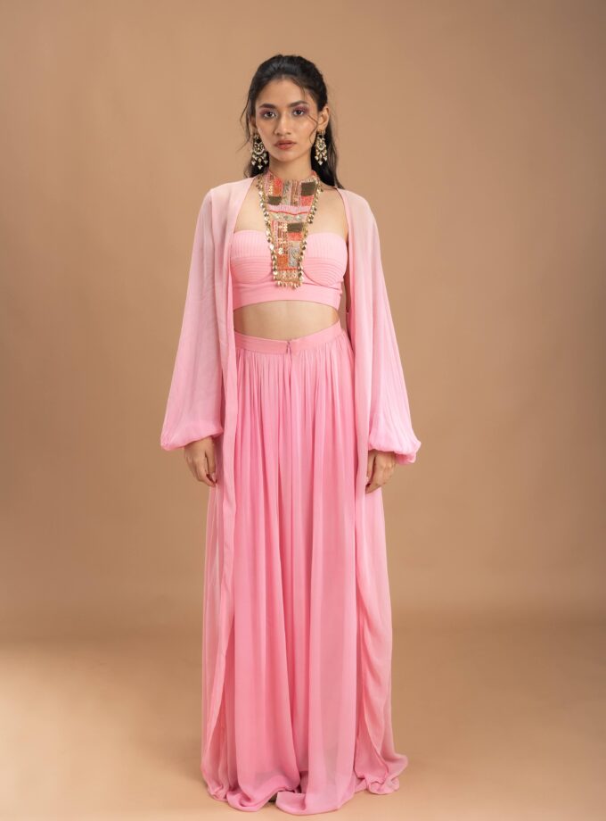 Pink Gathered georgette pants with korset choli embellished with intricate embroidery patch and a cape