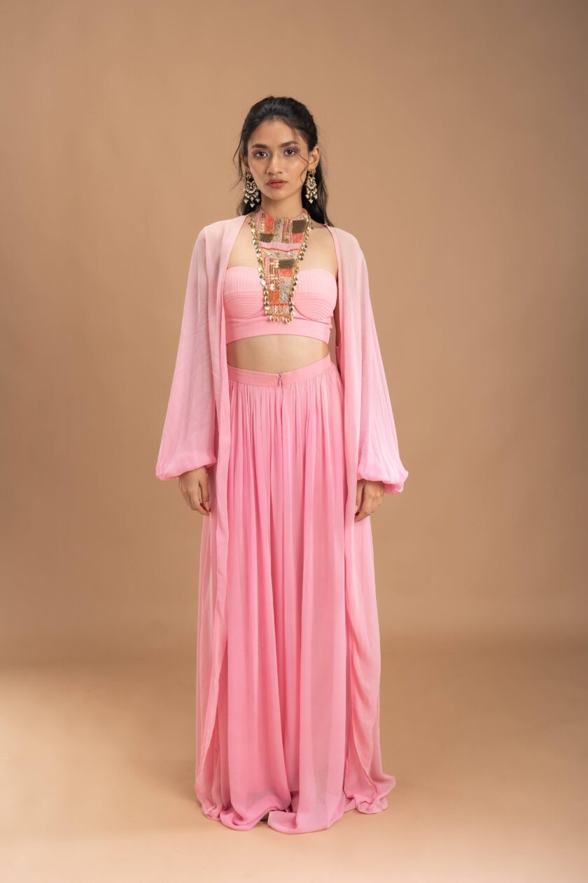 Pink Gathered georgette pants with korset choli embellished with intricate embroidery patch and a cape