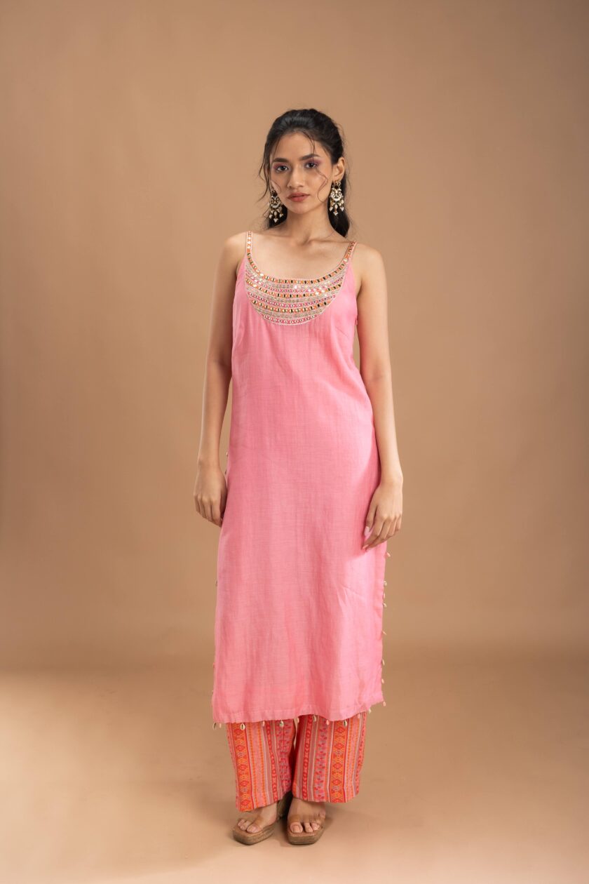 Pink silk kurta with embroidery on the neck and printed pants