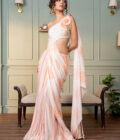 Ivory one shoulder drape saree with hand  embroidered motif