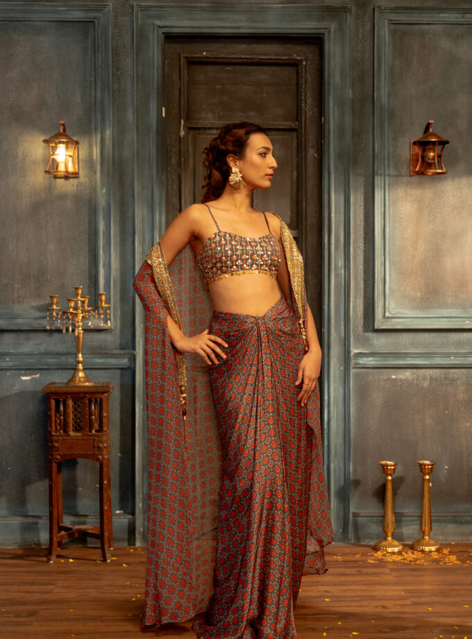 Teal checks printed silk draped skirt with  embroidered choli and cape