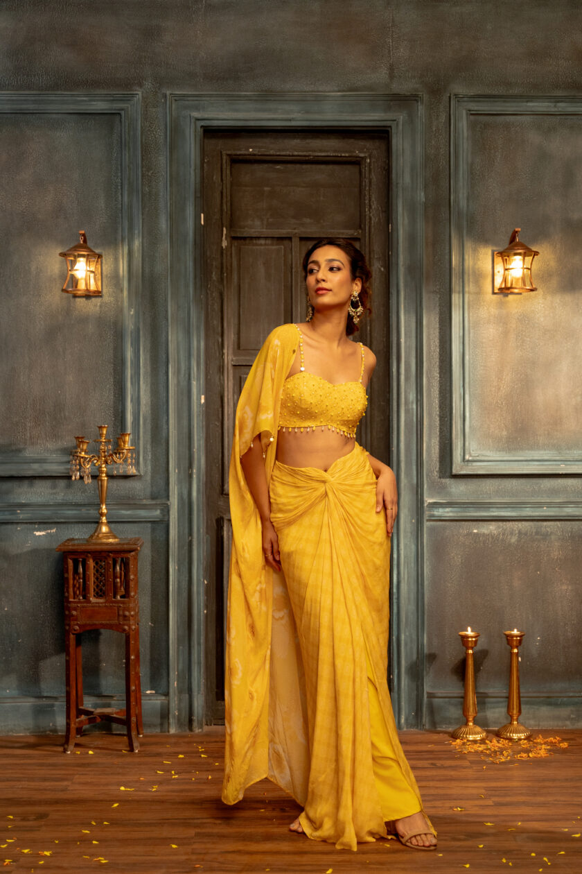 Yellow crepe silk drape skirt with embroidered  choli and cape