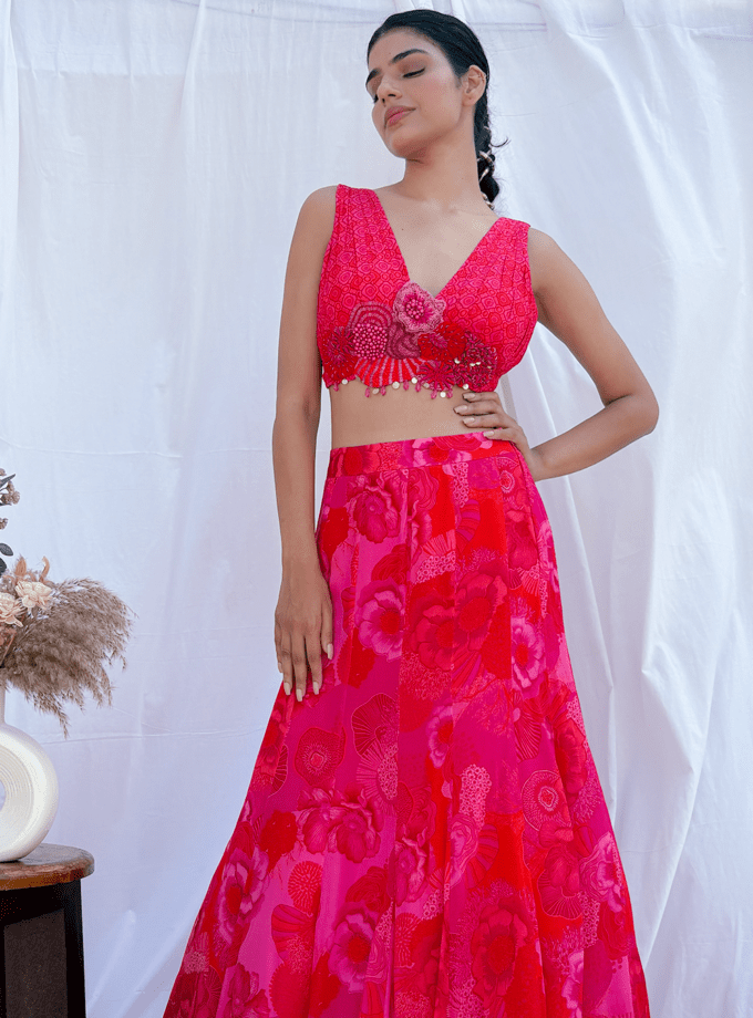Printed silk lehenga with draped choli and an embroidered motif