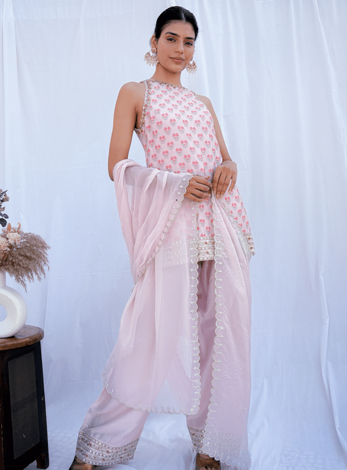 Short kurta with mirror work embroidery and a Farshi embroidered salwar